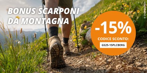 BONUS SCARPONI
Una donna fa trekking su un sentiero di montagna roccioso con cime sullo sfondo. Un cerchio arancione sulla destra indica "-15% codice sconto: GS25-15PLCBERG".