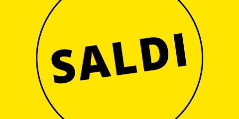 Sfondo giallo con la parola "SALDI" in grassetto nero all'interno di un cerchio nero.